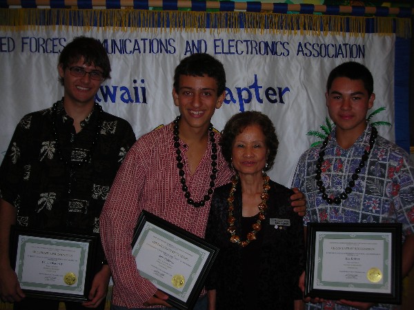 Award winners together in September are (l-r) William Trip Blaser III, Waialua High School, September Student of the Month; Sam Chalekian, Kaiser High School, August Student of the Month; Riglewicz; and Koa Knitter, St. Louis High School, September Student of the Month.
